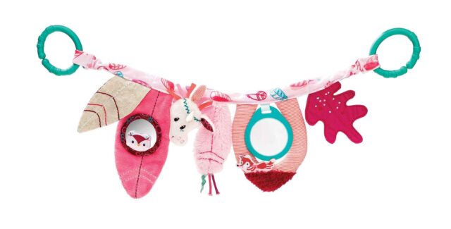 LI83018 LILLIPUTIENS- Fabric hanging toy Louise on a walk - Have fun on-the-go with this Louise the Unicorn activity toy. Simply attach to your baby's pram and watch them become entranced by the stimulating shapes, objects and sounds.
