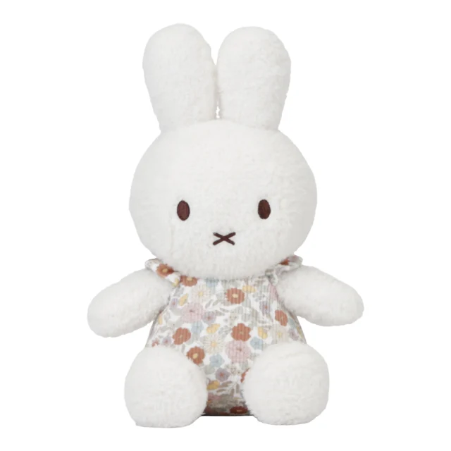 A white bunny with a floral vintage outfit