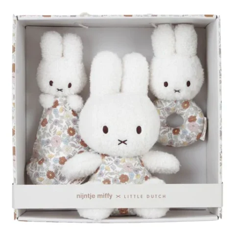 A box with 3 bunnies. A soft bunny doll, a rattle and a comfort cloth