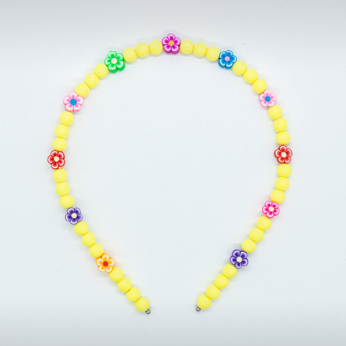 yellow tiara with beads and colored flowers